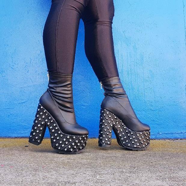 A stylish pair of Demonia Cramp-110 platform boots, perfect for The Cramps! vibe, pole dance, and festival fun.