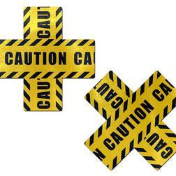 Caution signs with black and yellow stripes forming a cross shape, warning of potential hazards.