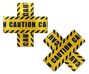 Caution signs with black and yellow stripes forming a cross shape, warning of potential hazards.