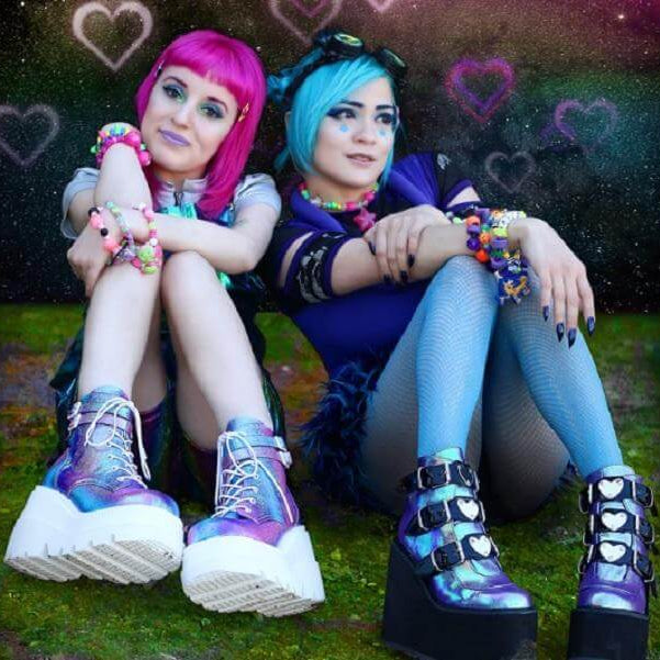 Festival Footwear - We have you covered! Stylish festival-goers in colorful shoes showcasing rave culture.