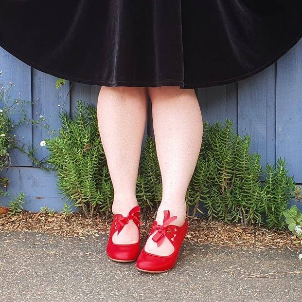 Image of stylish red shoes with bows, showcasing a playful Work Style - Follow Up Review! aesthetic.