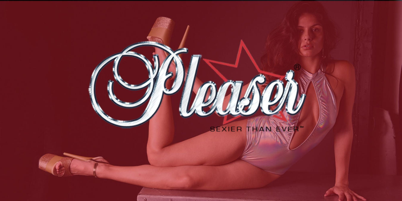 Model showcasing Pleaser platform heels and bold style in a seductive pose.