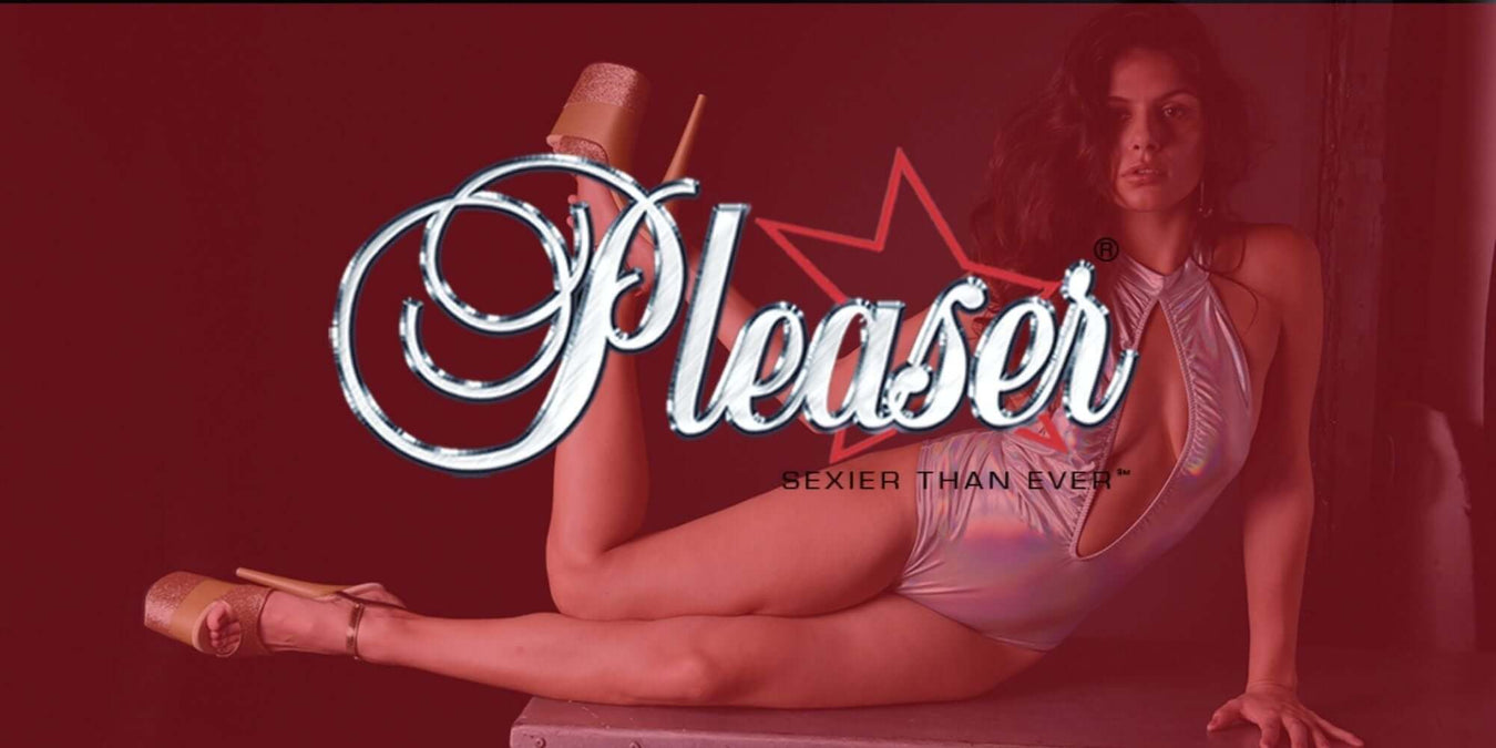 Model posing in Pleaser Heels & Boots with stylish graphic logo, showcasing bold footwear designs and confidence.